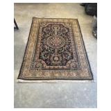 Traditional-style area rug.