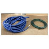 Blue rubber or PVC compressed air hose coiled up