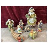9 pc.  Thanksgiving pilgrim woman figurine ,