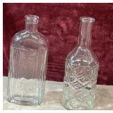 2 pc. vintage clear  glass bottles.