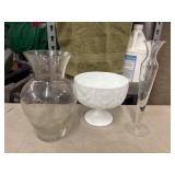 Tall, slender glass bud vase with delicate etched