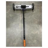 Rolling magnetic floor sweeper
