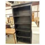 Tall black 5-shelf open bookcase.