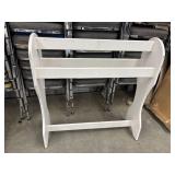 White wooden freestanding quilt/blanket rack.