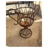Rustic wrought iron urn planter.