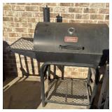 Outdoor Gourmet black barrel-style charcoal grill