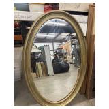 Vintage oval wall mirror with a classic
