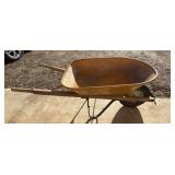 Standard single-wheel metal wheelbarrow with a