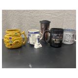 A collection of five Star Wars-themed ceramic