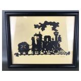 Vintage paper-cut steam locomotive silhouette
