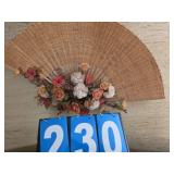 large wall hanging fan with flowers
