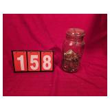 1 gallon mason jar with coins in it