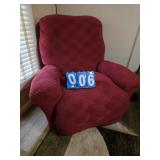 older arm chair with red cover