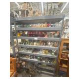 7 shelves of assorted candles and candle holders