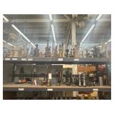 2 shelves of assorted candles and candle holders