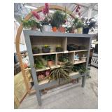 Wood cabinet with plants