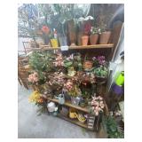 Shelf unit with assorted pots and plants
