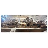 Top shelf of assorted brown wicker chairs