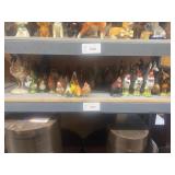 1 shelf of assorted small rooster statues