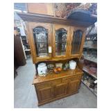 Wood cabinet with assorted decorations