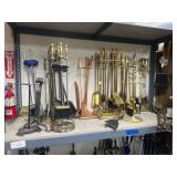 Middle shelf of fireplace accessories