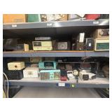 2 shelves of assorted radios