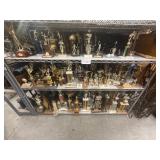 5 shelves of assorted trophies