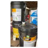 3 CAT containers with hydraulic oil, may have
