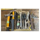 Tool caddy with hammers, chisels and square