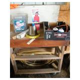 wood work table, nails, fire extinguisher, hose