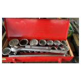 Red tool box with set of tractor sockets, full