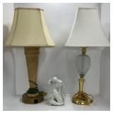 Two Table Lamps and a Seated Figure Sculpture