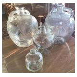 Four Glass Jugs with Embossed Leaf Pattern