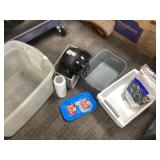 Household Items Including Helmet and Storage Bins