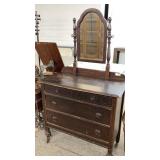 Wooden Dresser With an Attached Mirror