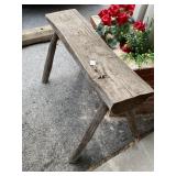 Rustic Wooden Bench with Four Legs