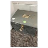 Grey metal file box with key, shows wear