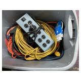 Plastic Bin with Extension Cords and Power Strip