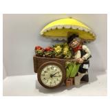 Figurine Wall Clock with Flower Cart Design