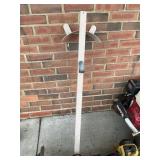 Metal Water Spigot Mounted on Wooden Post