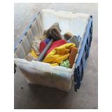 Tub full of cleaning, rags and brushes