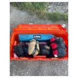 Camping gear in Orange Plano trunk, including...