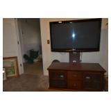 Entertainment center with TV, works