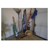 2 flags, 2 rakes, umbrella, trellis, shrub