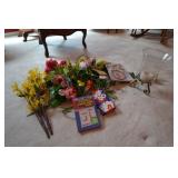 Artificial flowers, candle, light globe