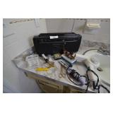 Radio, curling iron, hair dryer, clock