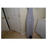 Ironing board with iron