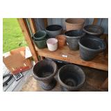 Flower pots, mostly plastic