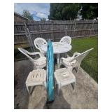 Plastic table, 4 chairs, 3 tables, umbrella and