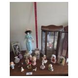 Small curio cabinet with miniatures